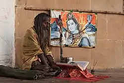 Hindu sadhu with Lord Shiva in Uttar Pradesh, India.