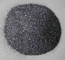 Gray silicon powder, an element. All the other ones are chemical compounds.