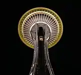 The bottom of the Space Needle at night.