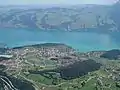 Spiez from the air, with the lake in the background and the Kander bottom left