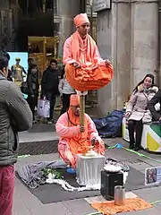 Two street performers doing acrobatics in Milan, Italy.