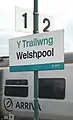 A station sign in Welsh and English