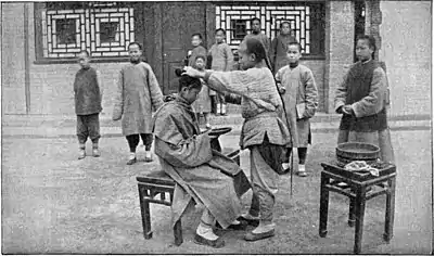 Chinese Characteristics - A Chinese Barber.jpg