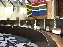 The judges' table in a courtroom of the Constitutional Court of South Africa at Constitution Hill, Braamfontein, Johannesburg.