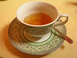 An orange tea in a teacup